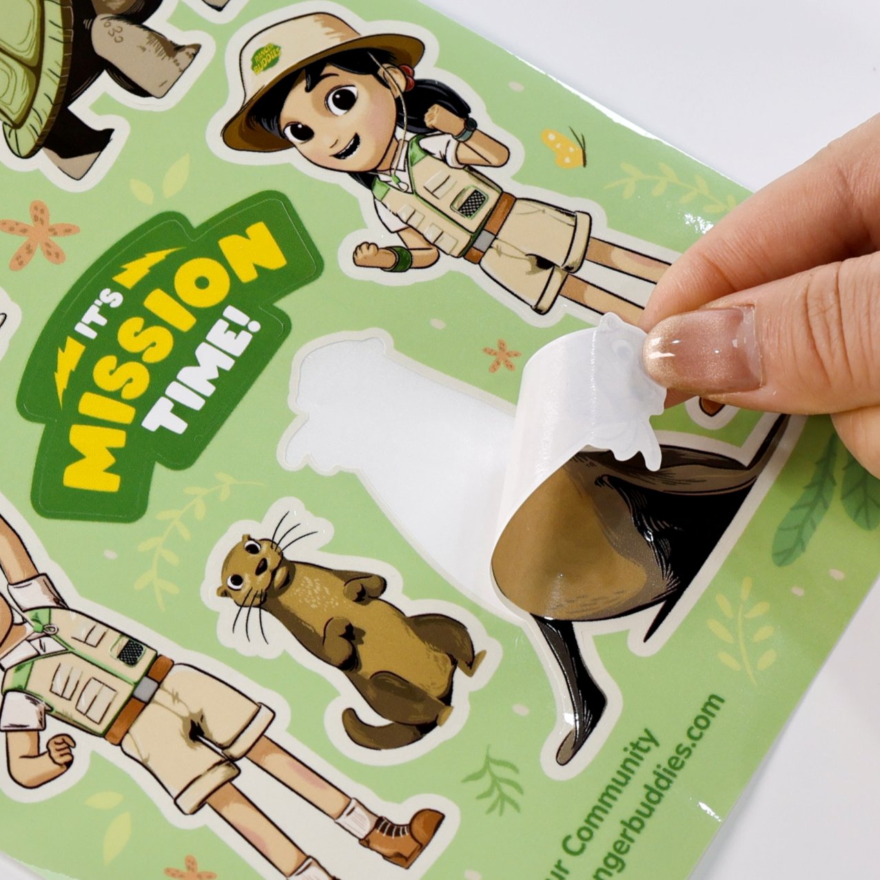 Kiss-cut sticker sheet being peeled