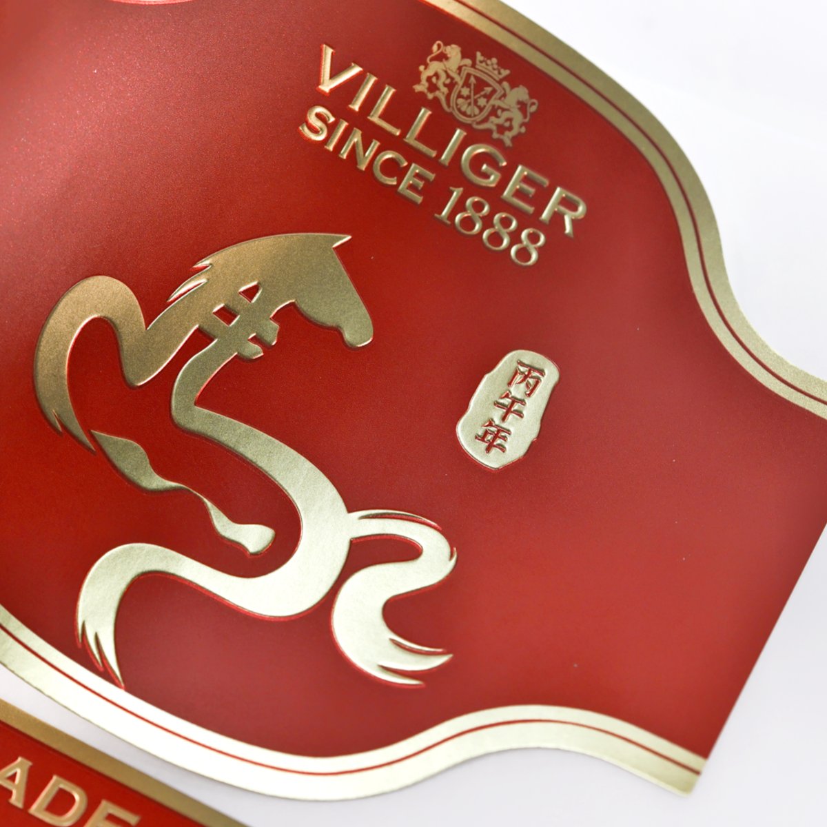 Embossed label with foil stamping combination finish
