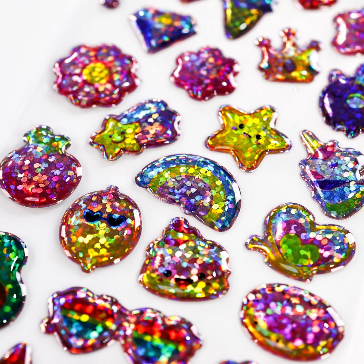 Soft dome stickers in kawaii shapes — stars, hearts, flowers, clouds and bears with rainbow glitter under flexible resin