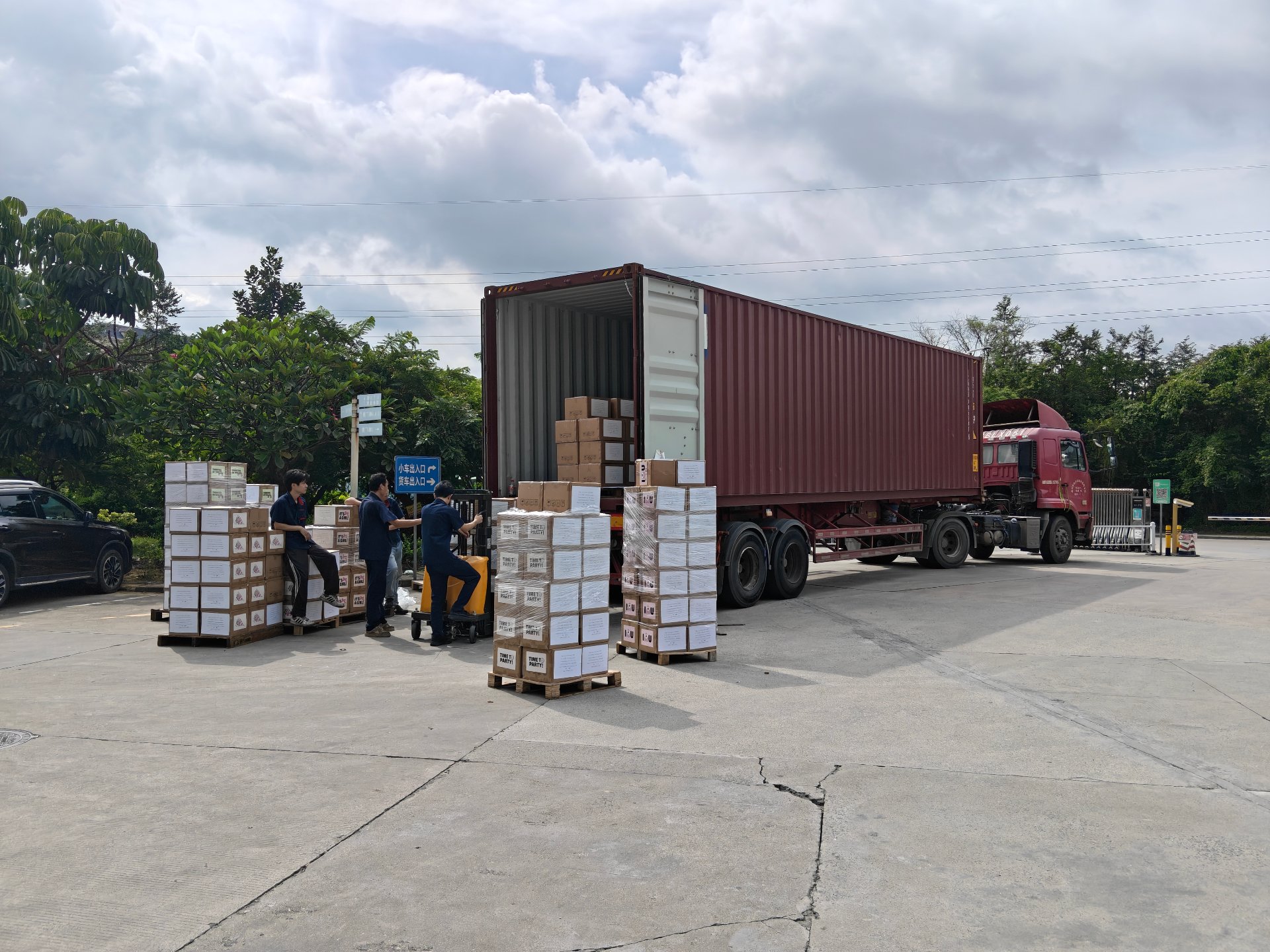Container truck being loaded with palletized label shipments