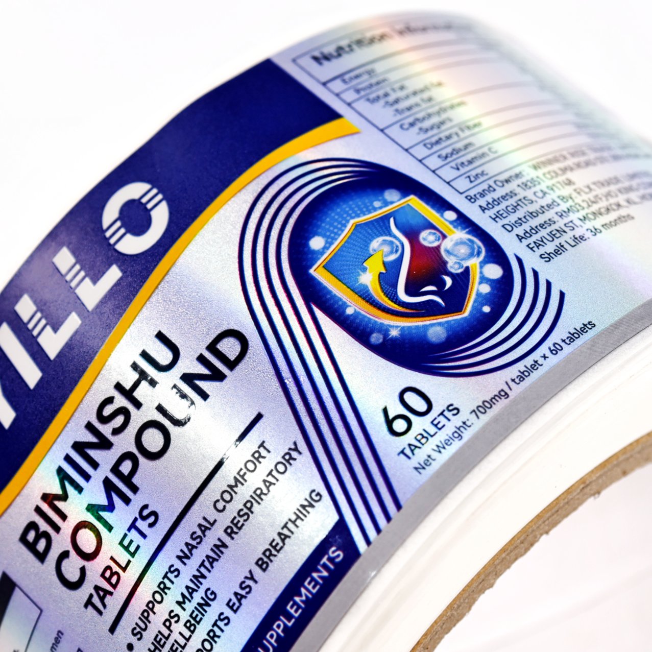 Holographic rainbow label on supplement bottle showing iridescent sheen