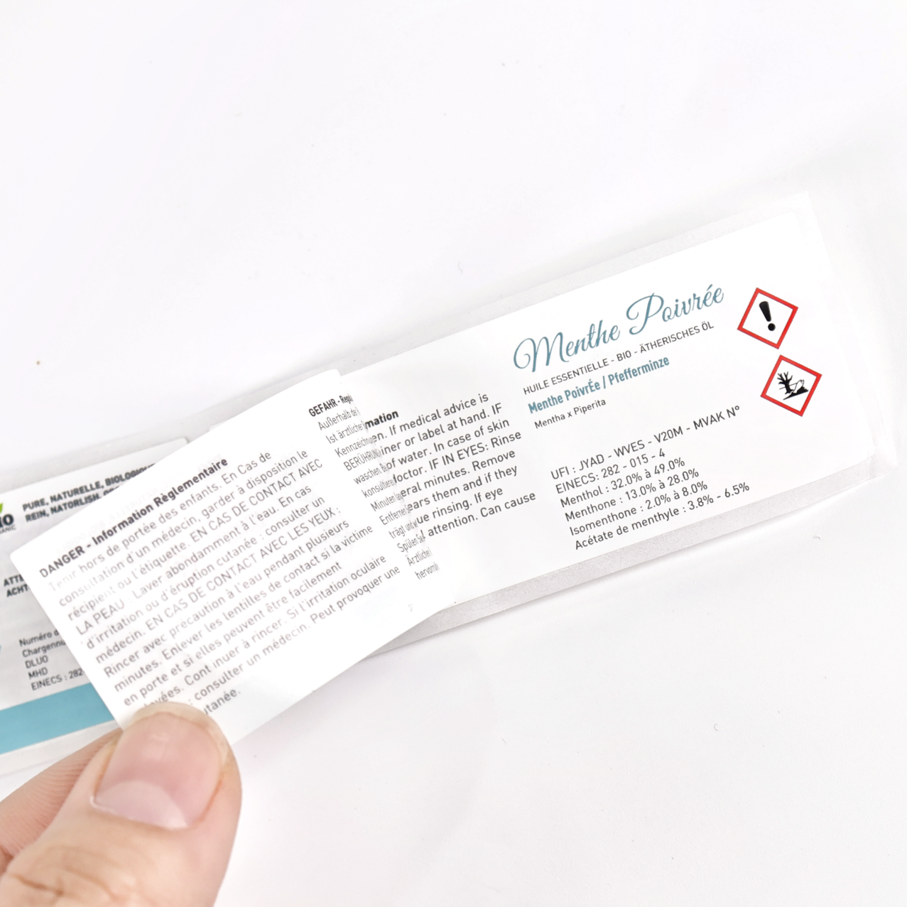 Rectangular booklet label with multi-language regulatory text