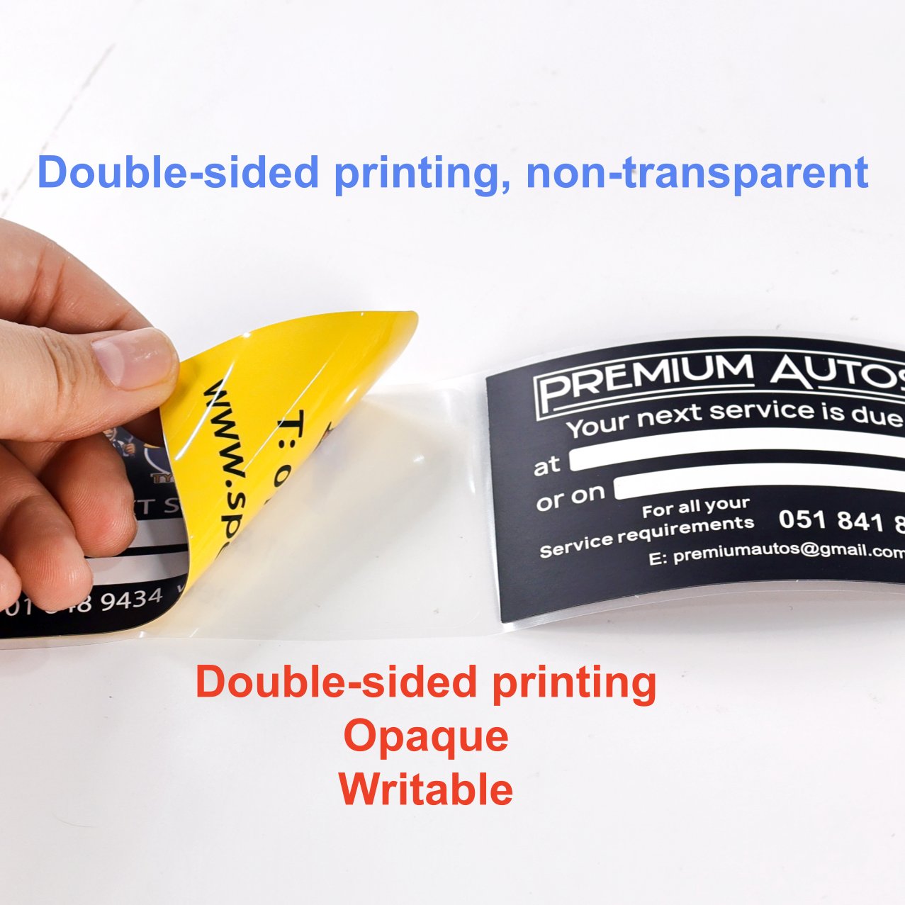 Opaque double-sided printed sticker peeled from its liner, showing the opaque construction