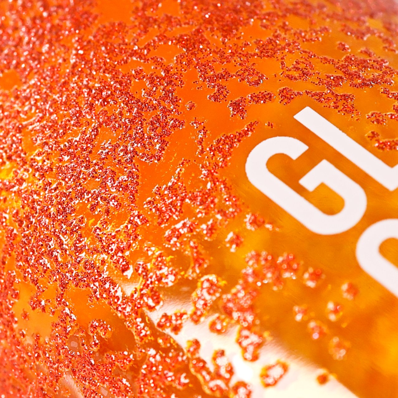 Silk-screen glitter close-up showing chunky glitter texture