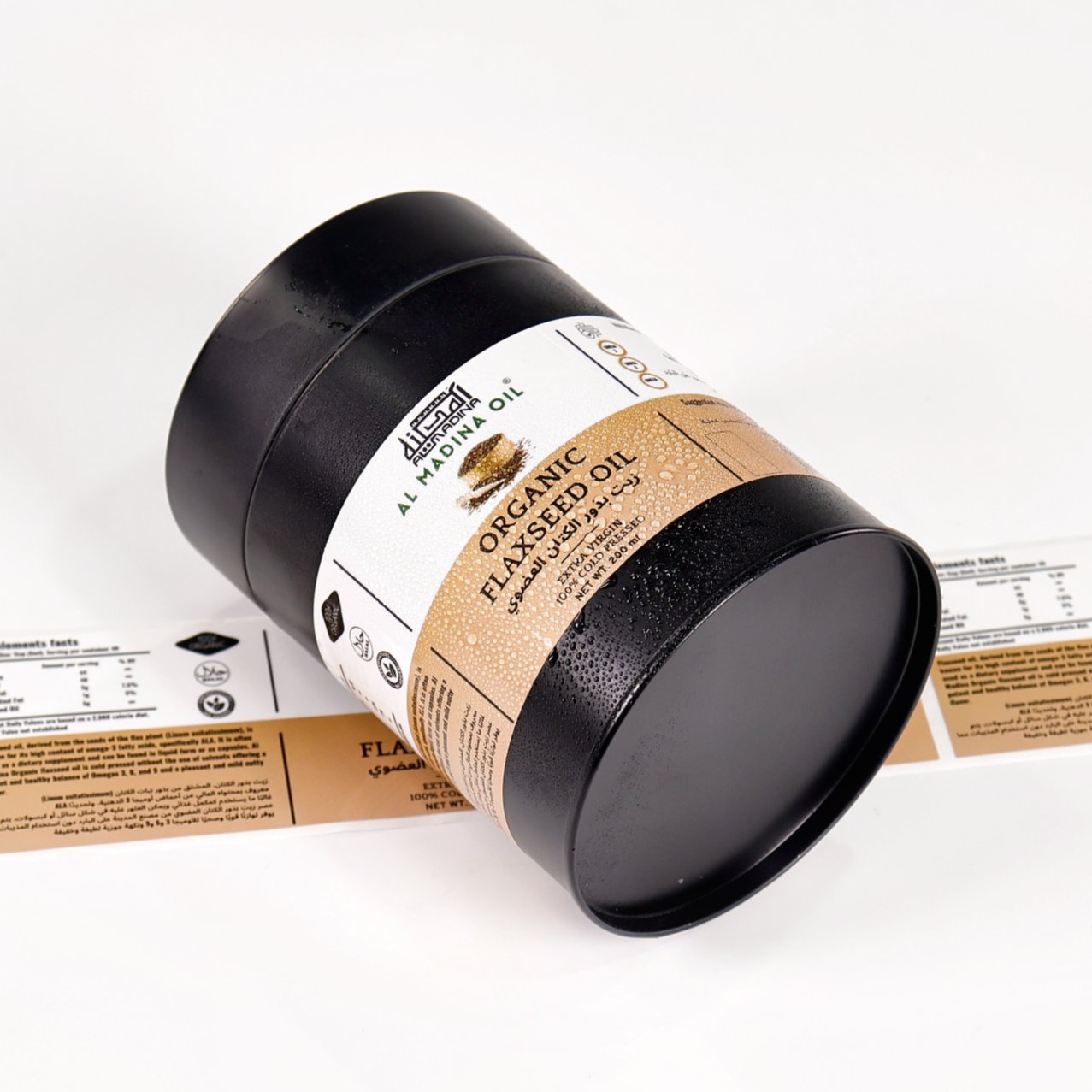 Organic flaxseed oil tin with a wrap-around printed label including a nutrition facts panel
